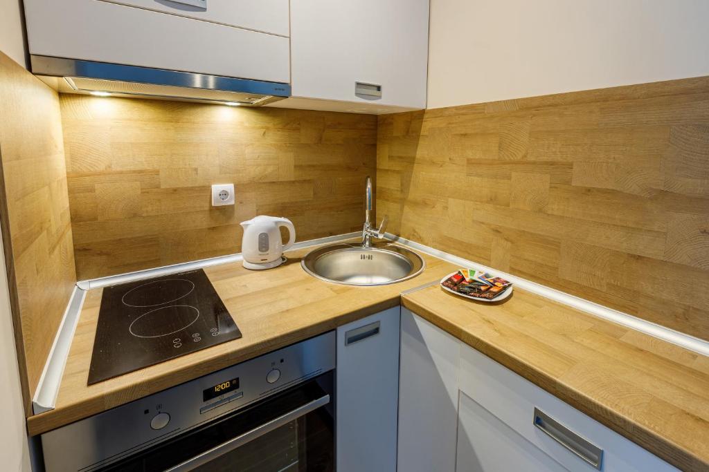 Kuchyň nebo kuchyňský kout v ubytování Annona Apartments