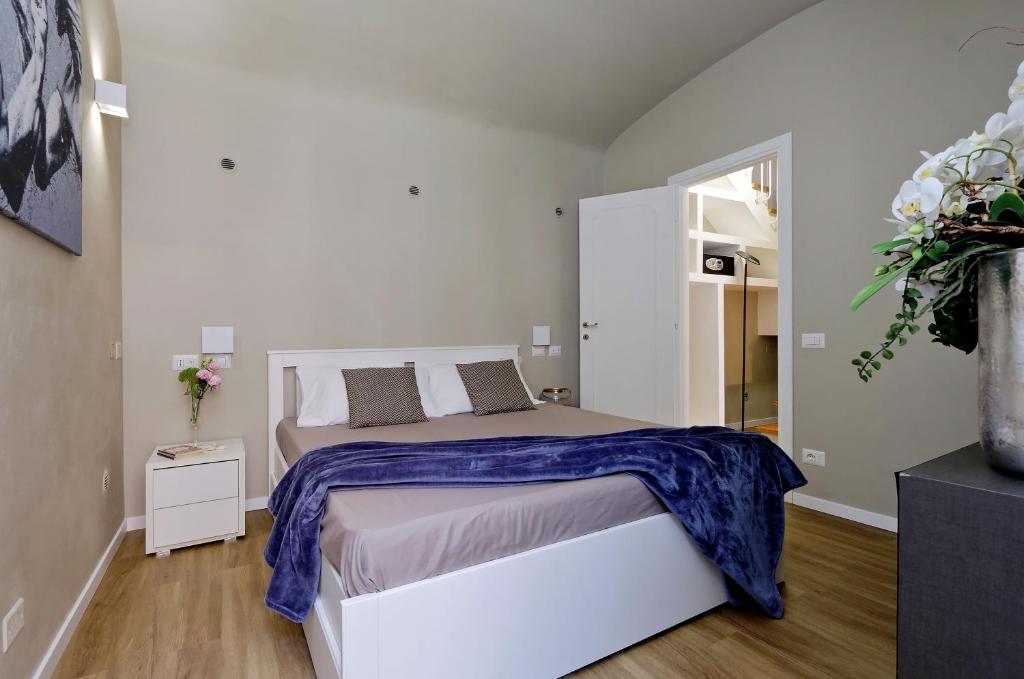 Postel nebo postele na pokoji v ubytování Il Borgo Luxury Suites