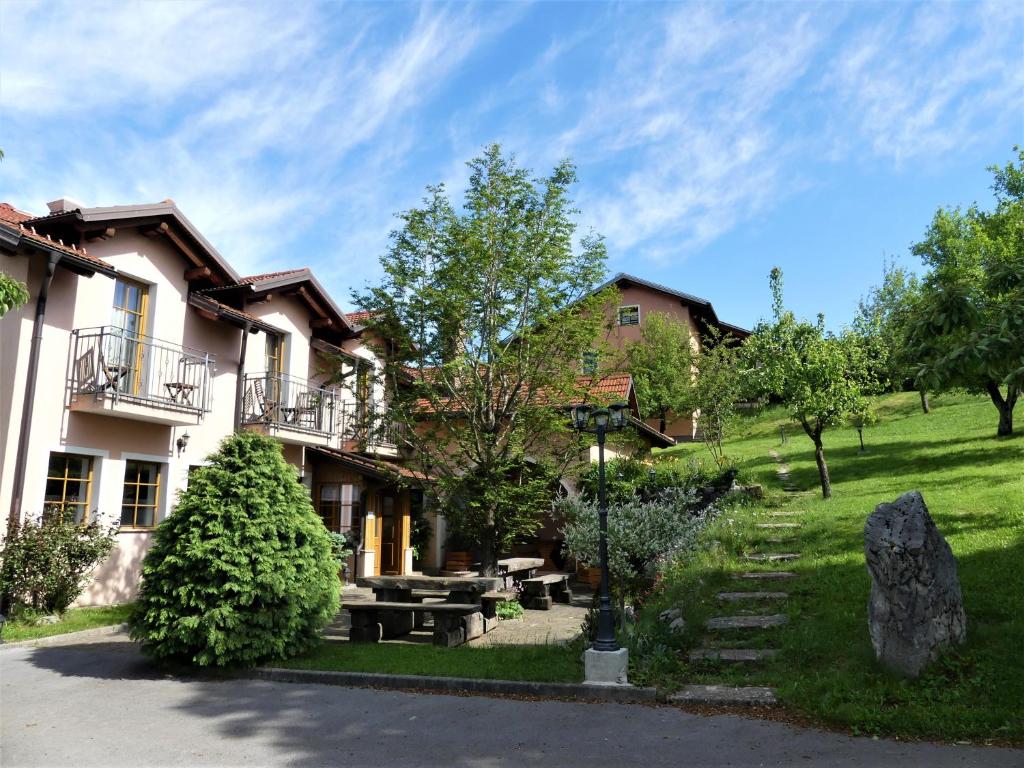 a house with a picnic table in front of it at Pension Na Meji in Pivka