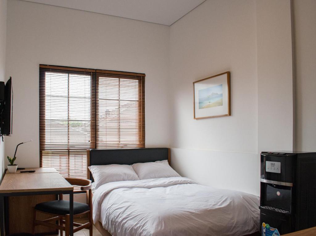 Postel nebo postele na pokoji v ubytování Rumanami Residence