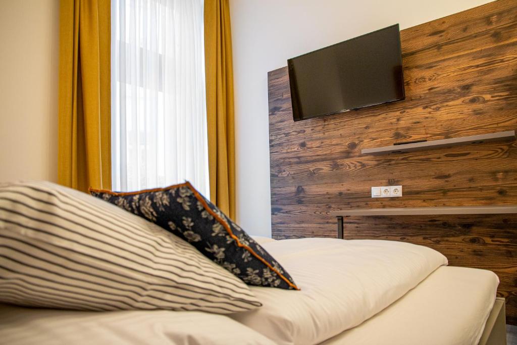 Postel nebo postele na pokoji v ubytování City Hotel Bamberg