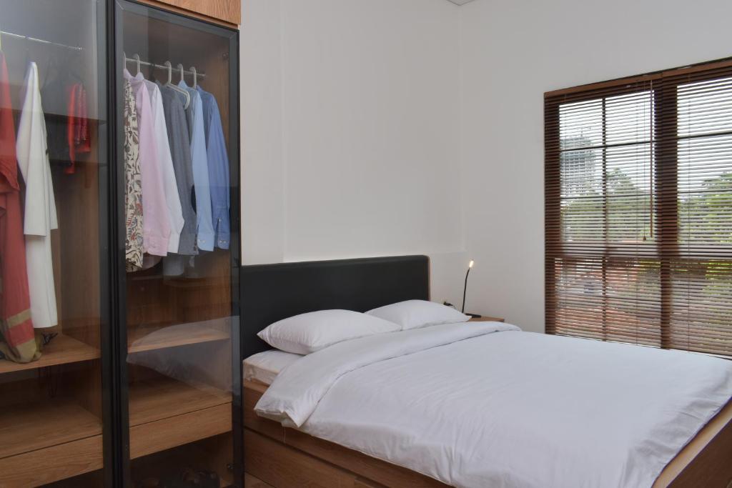 Postel nebo postele na pokoji v ubytování Rumanami Residence