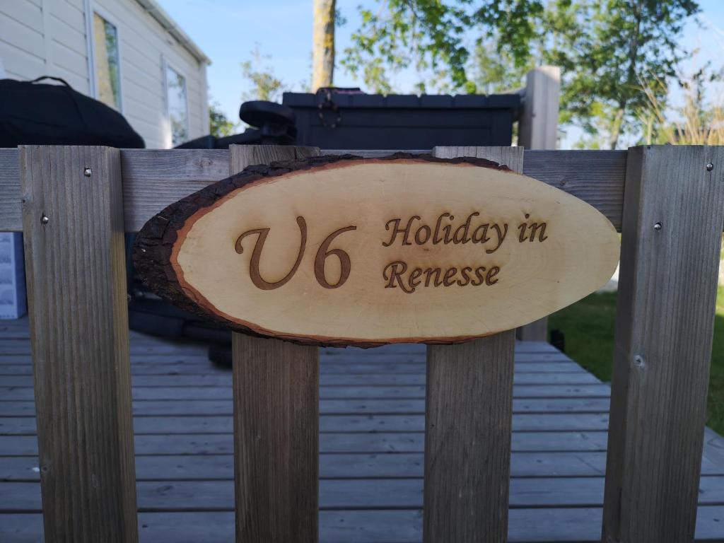 a sign that reads us holidays in remission on a wooden fence at Holiday in Renesse in Renesse