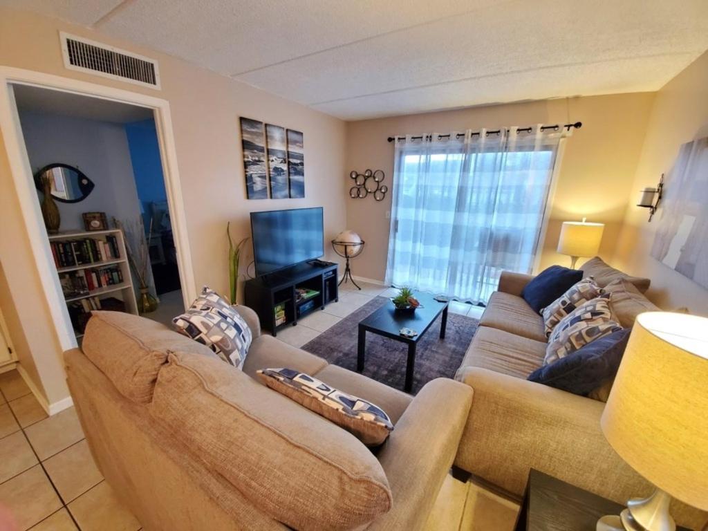 a living room with a couch and a television at St, Augustine Ocean And Racquet 2204 Condo in St. Augustine