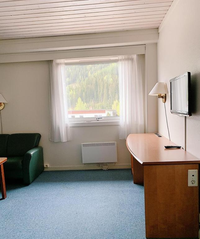 TV a/nebo společenská místnost v ubytování Rødberg Hotel