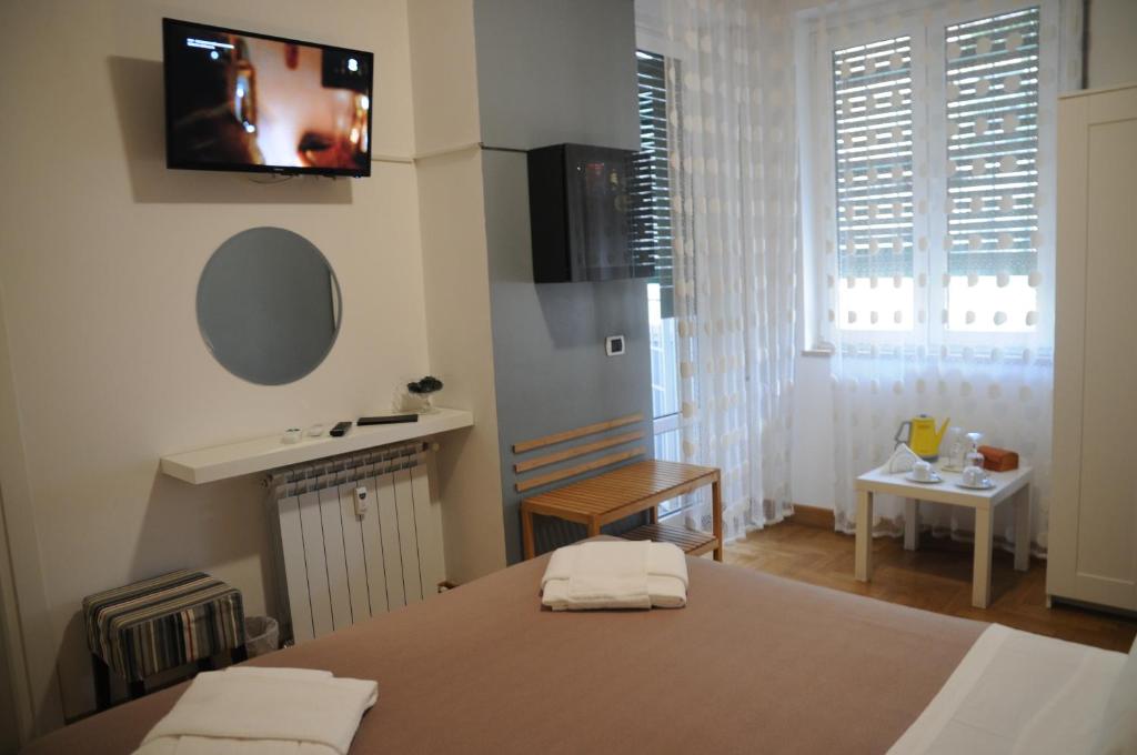 Posteľ alebo postele v izbe v ubytovaní Sweet Home Parioli