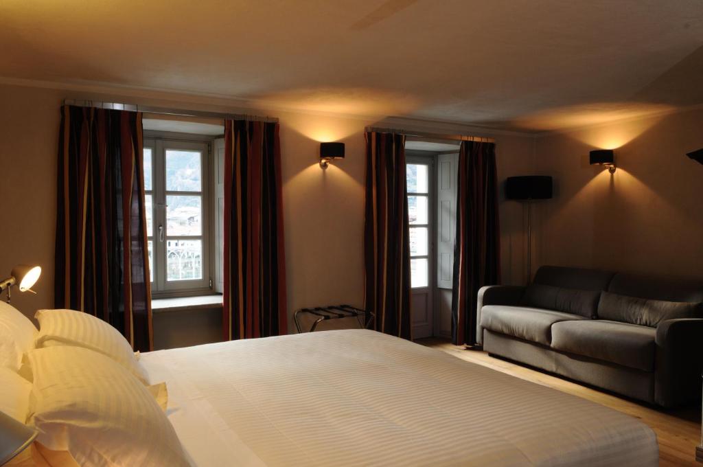 Postel nebo postele na pokoji v ubytování Hotel Ad Gallias