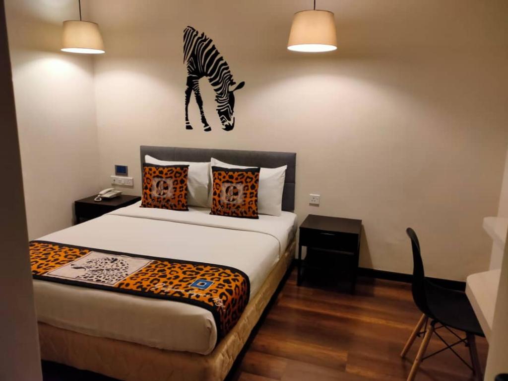 Postel nebo postele na pokoji v ubytování 9 Square Hotel - Subang