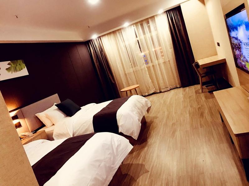 Ένα ή περισσότερα κρεβάτια σε δωμάτιο στο Up And In Kashgar Shache County Buxing Street