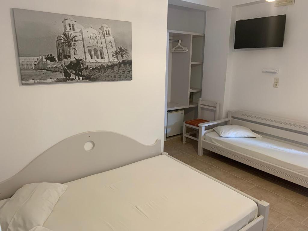 Łóżko lub łóżka w pokoju w obiekcie Noufaro