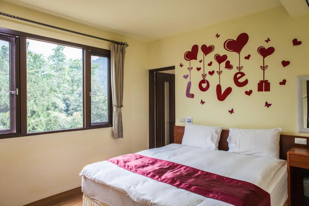 Postel nebo postele na pokoji v ubytování Sin Ging Hong Resort