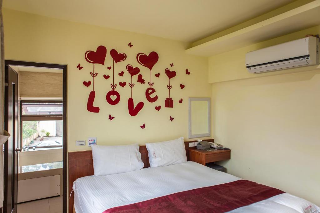 Postel nebo postele na pokoji v ubytování Sin Ging Hong Resort