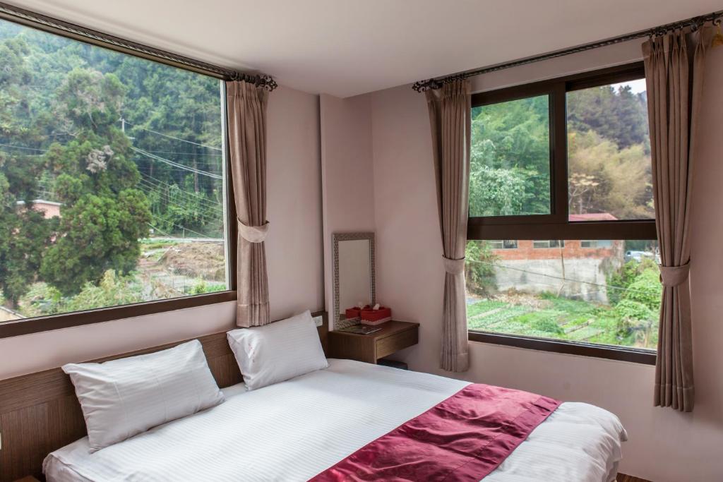 Postel nebo postele na pokoji v ubytování Sin Ging Hong Resort