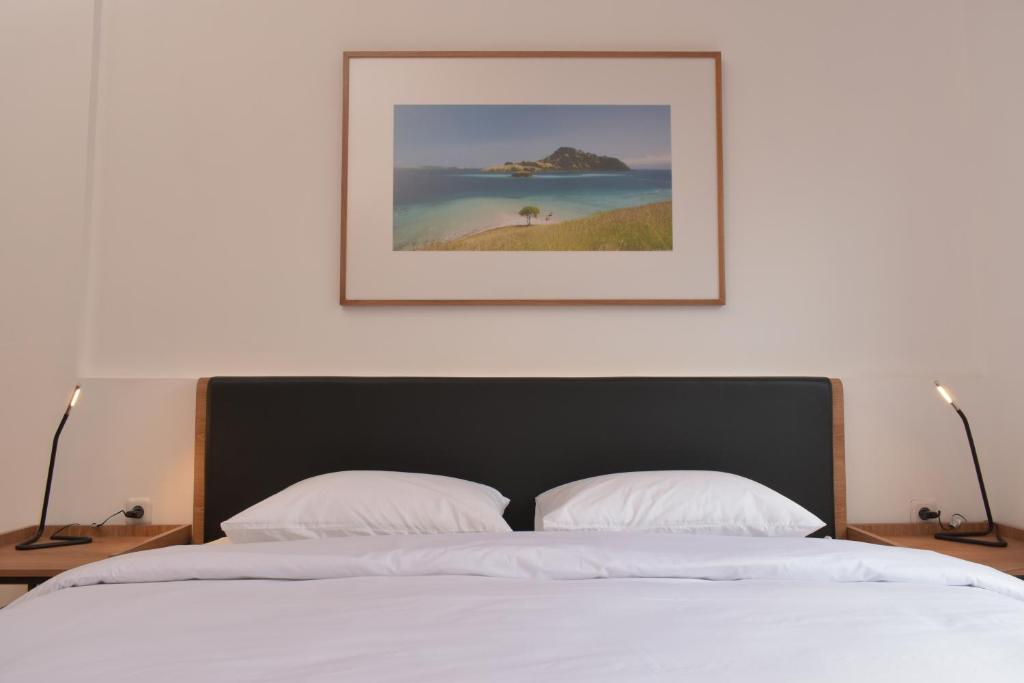Postel nebo postele na pokoji v ubytování Rumanami Residence