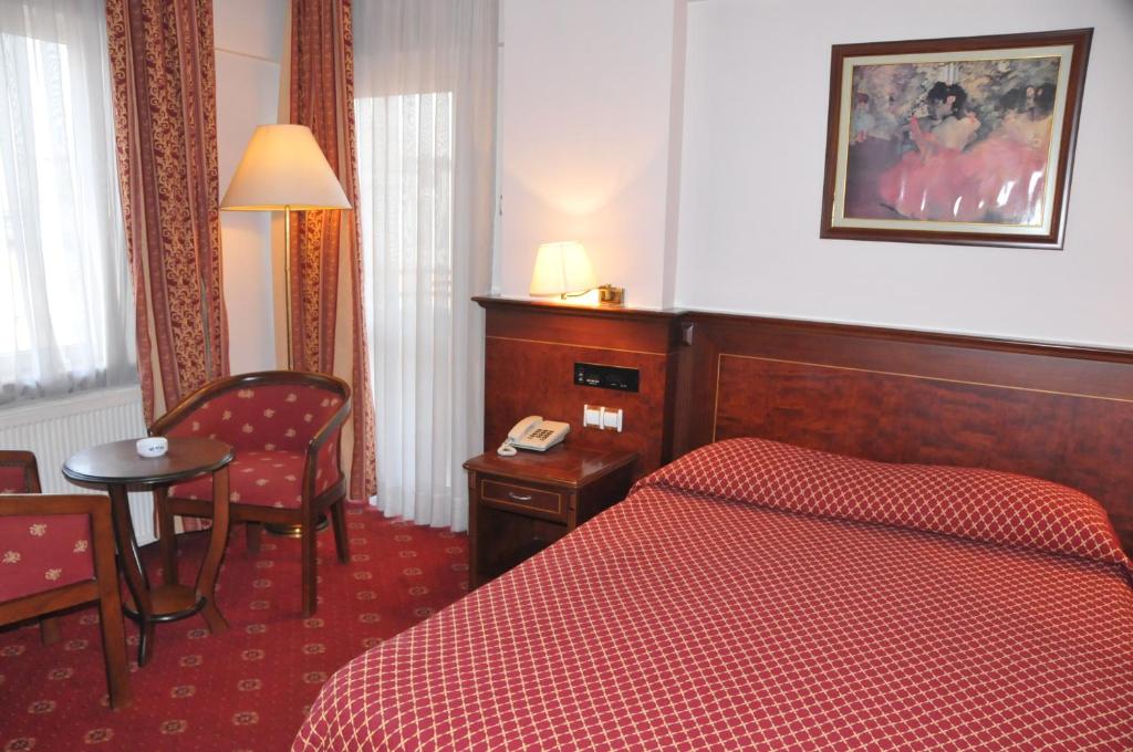 Postel nebo postele na pokoji v ubytování Ozilhan Hotel