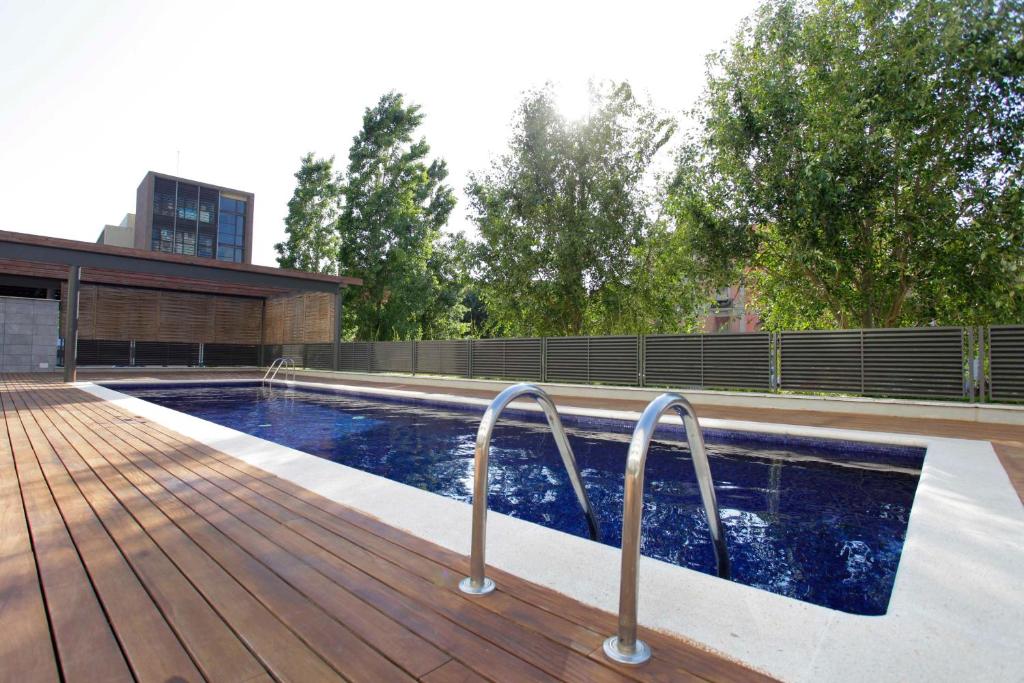 Bazén v ubytovaní 1217 - POOL AND BEACH NICE APARTMENT II alebo v jeho blízkosti