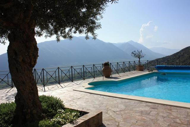 a swimming pool with a view of the water at La Codarda country house in Pescosolido