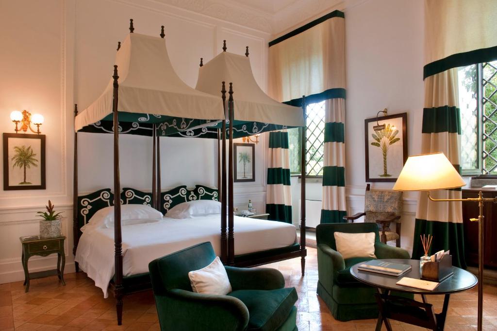 Postel nebo postele na pokoji v ubytování La Posta Vecchia Hotel