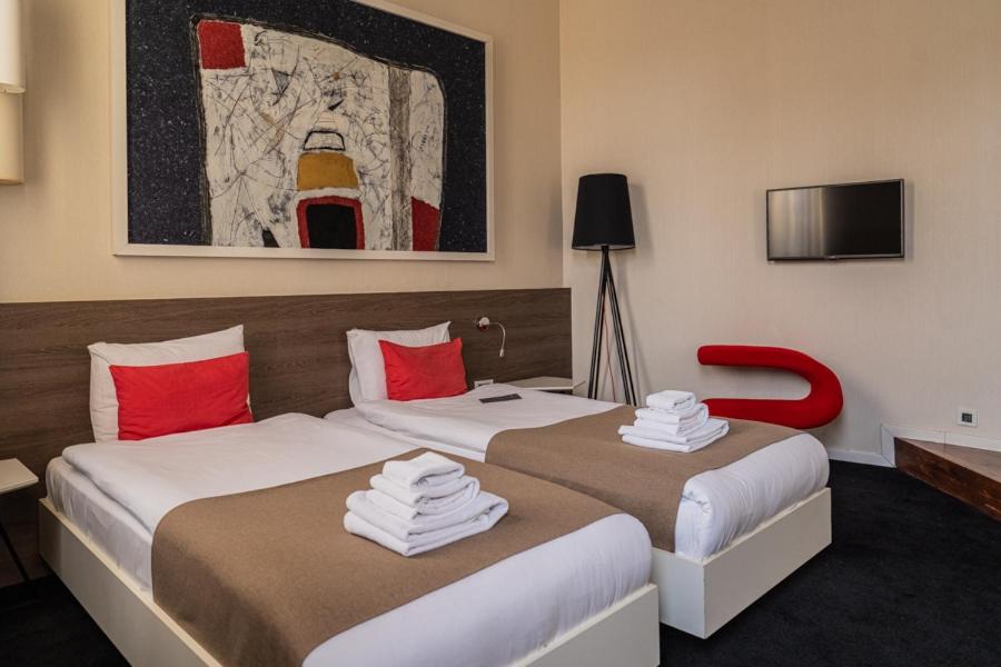 Postel nebo postele na pokoji v ubytování Garni Hotel Eter
