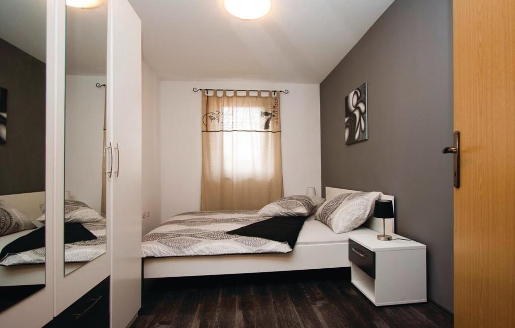 Postel nebo postele na pokoji v ubytování Appartement Stalno Sretan