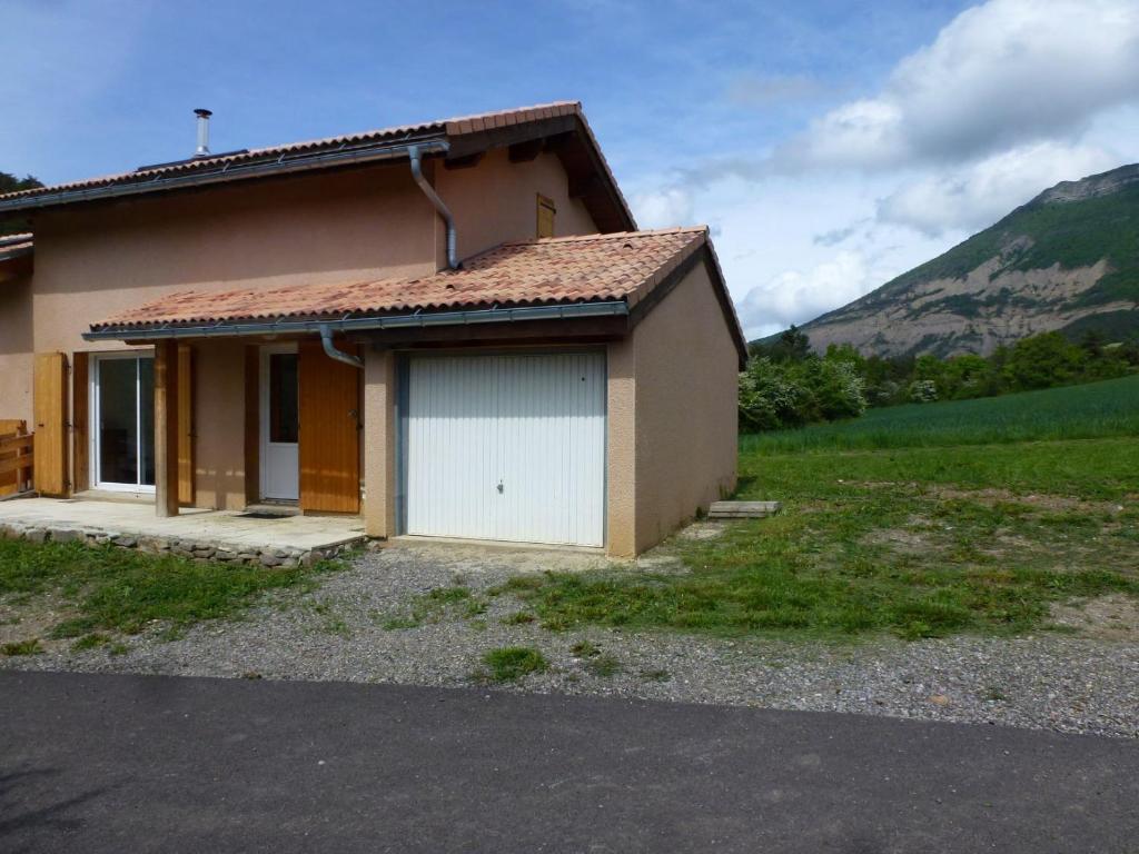 a small house with a white garage at La longeagne in Aspres-sur-Buëch