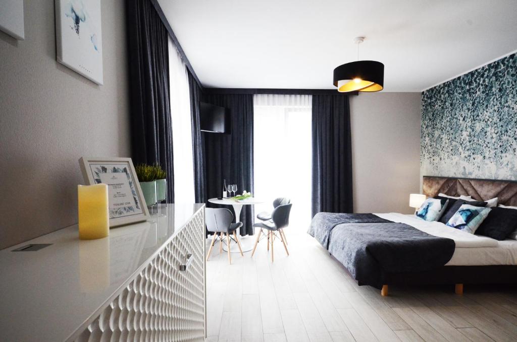 Posteľ alebo postele v izbe v ubytovaní Apartamenty Biała Sowa Czarna Góra