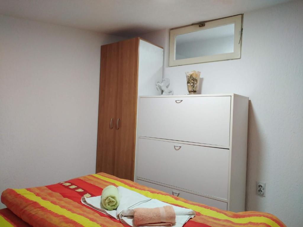 Postel nebo postele na pokoji v ubytování Apartmani Odmor i Mir