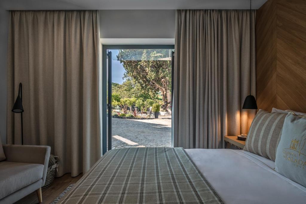 Uma cama ou camas num quarto em Quinta da Salada - Turismo Rural