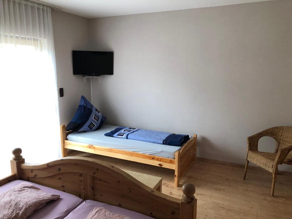 Postel nebo postele na pokoji v ubytování Gästehaus Lara