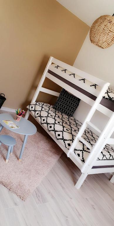 Postel nebo postele na pokoji v ubytování Le cosy de sarah