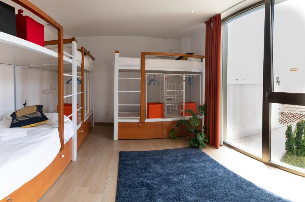A bed or beds in a room at Youth Hostel Jávea