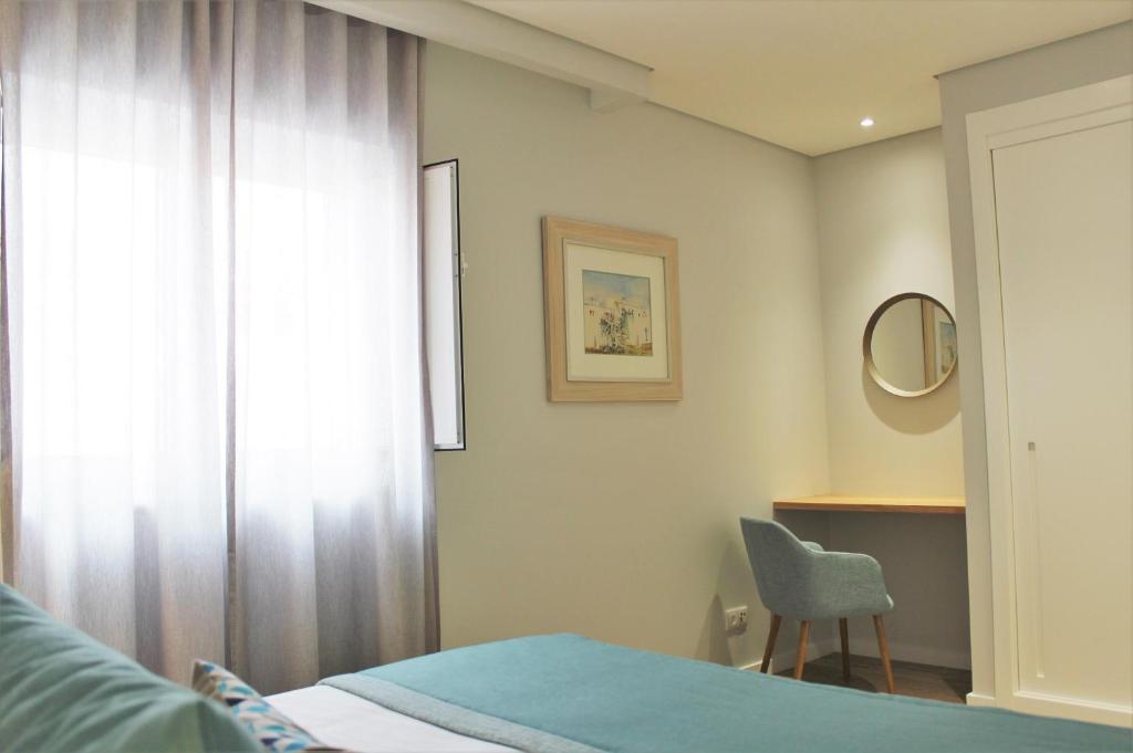 Postel nebo postele na pokoji v ubytování Cardeal Suites & Apartments