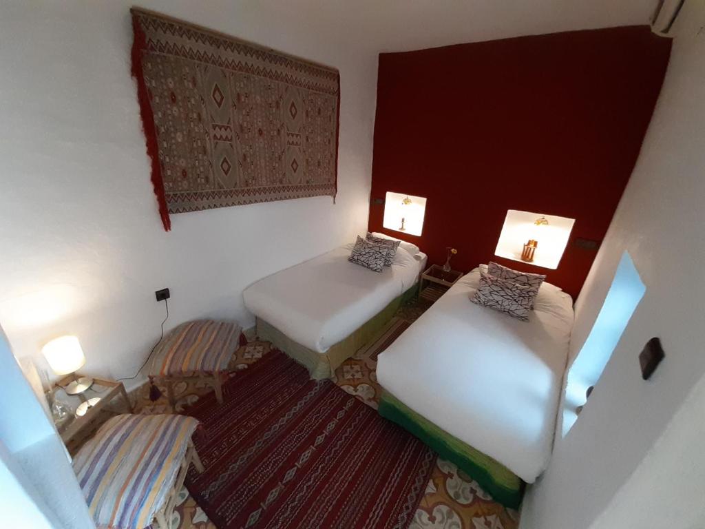 Uma cama ou camas num quarto em Hotel Casa Miguel