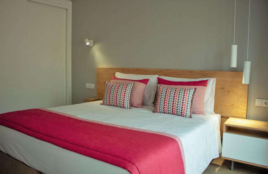 Postel nebo postele na pokoji v ubytování Cardeal Suites & Apartments