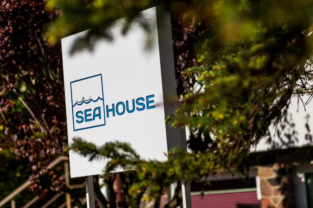 a sign for asea house in front of a building at Sea House Gdynia in Gdynia