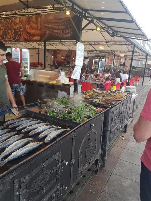a market with many different types of fish on display at EVA Studio Eforie Nord in Eforie Nord