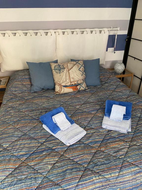 Łóżko lub łóżka w pokoju w obiekcie La Dinette Riomaggiore