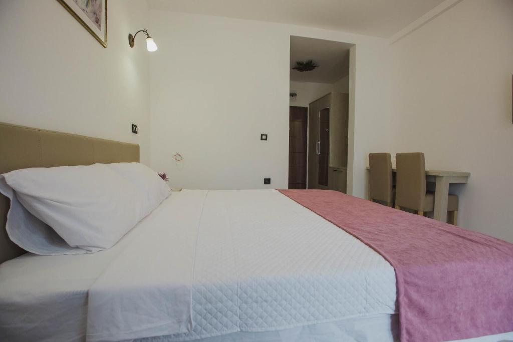Postel nebo postele na pokoji v ubytování Hotel Dapčević