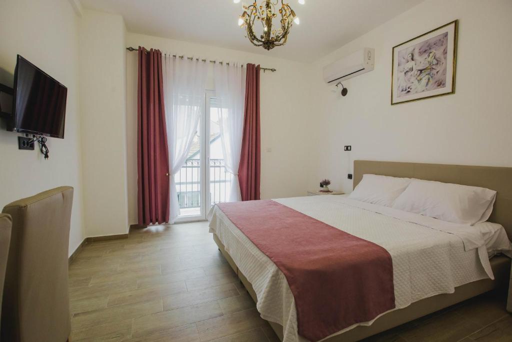 Postel nebo postele na pokoji v ubytování Hotel Dapčević