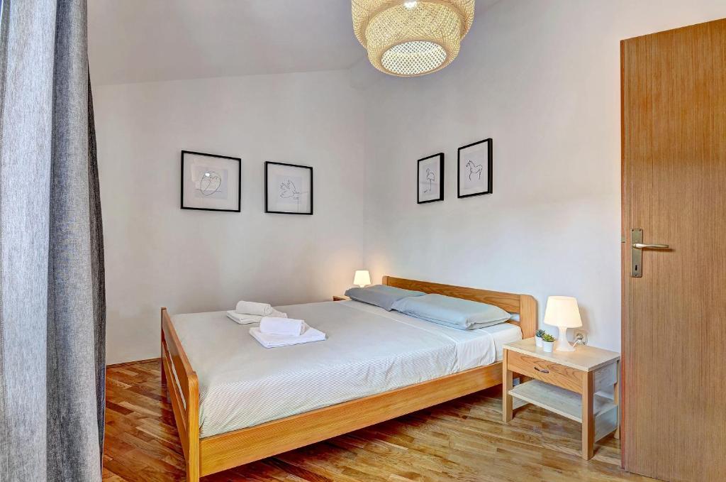Postel nebo postele na pokoji v ubytování Apartment Adriana