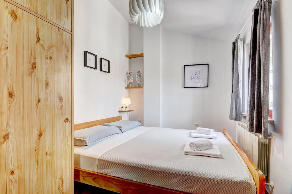 Postel nebo postele na pokoji v ubytování Apartment Adriana