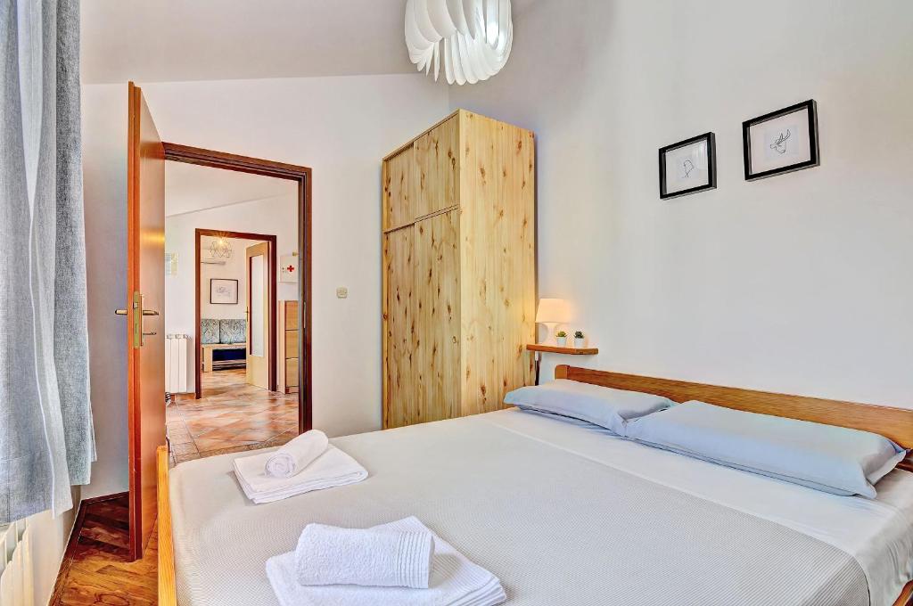 Postel nebo postele na pokoji v ubytování Apartment Adriana