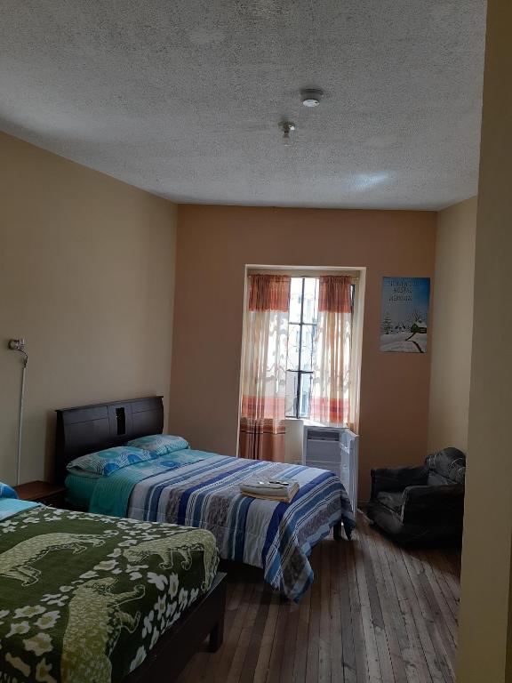 Postel nebo postele na pokoji v ubytování Hostal Mediodia