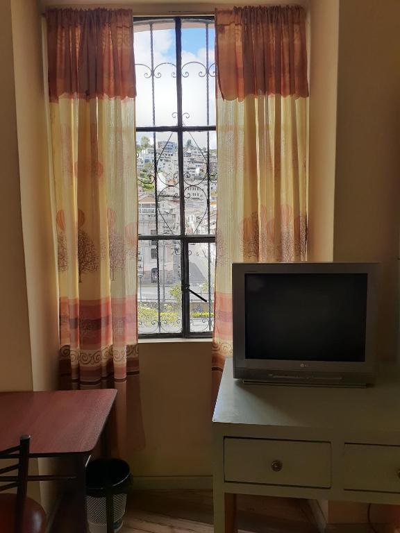 TV a/nebo společenská místnost v ubytování Hostal Mediodia