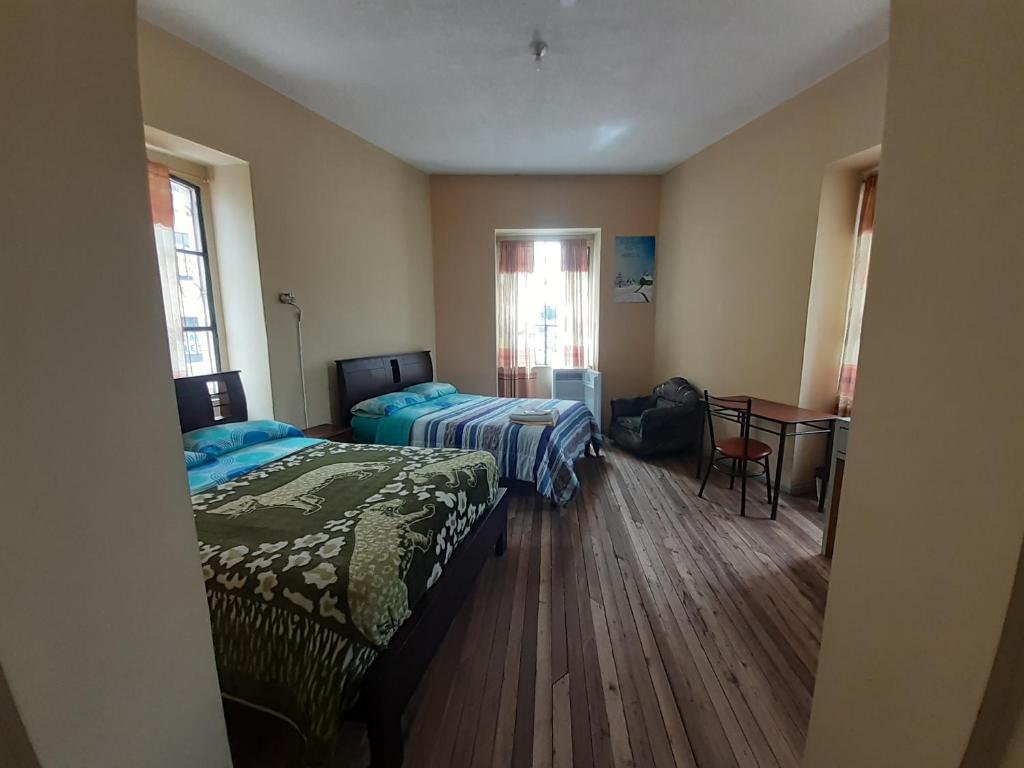 Postel nebo postele na pokoji v ubytování Hostal Mediodia