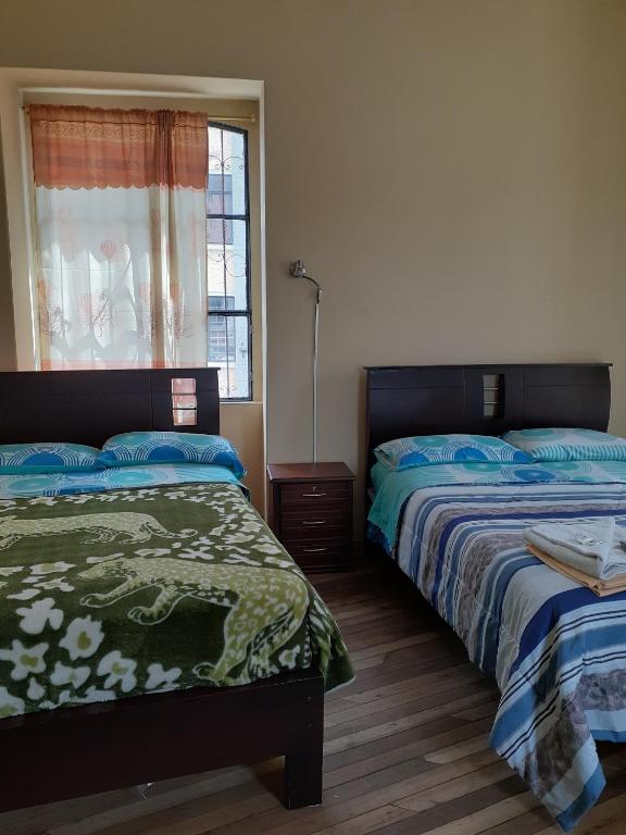 Postel nebo postele na pokoji v ubytování Hostal Mediodia