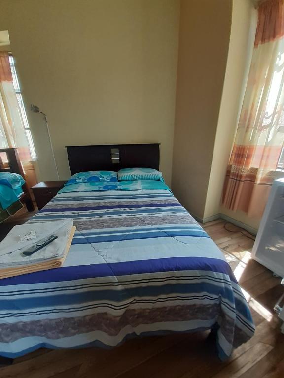 Postel nebo postele na pokoji v ubytování Hostal Mediodia