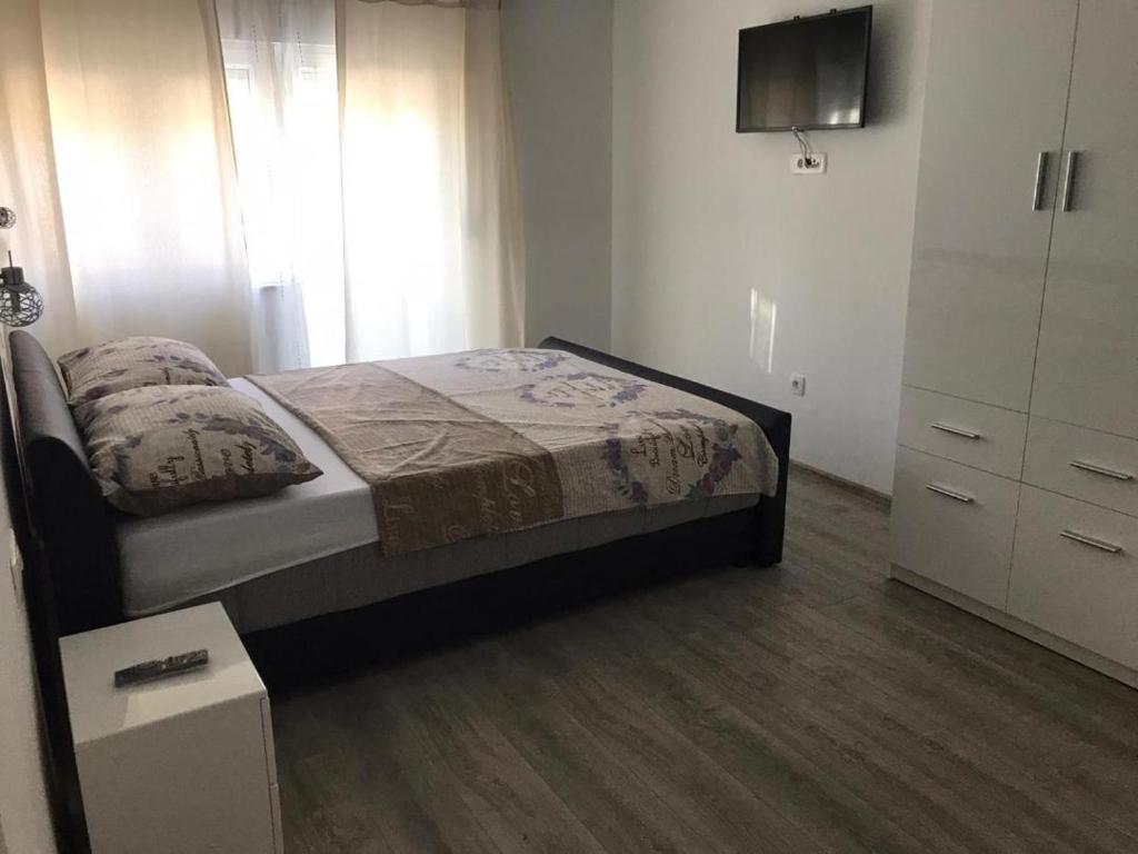 Postel nebo postele na pokoji v ubytování Apartmani Jukic