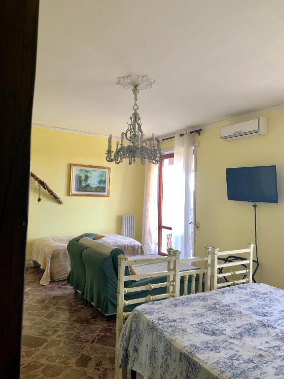 Postel nebo postele na pokoji v ubytování Larala'