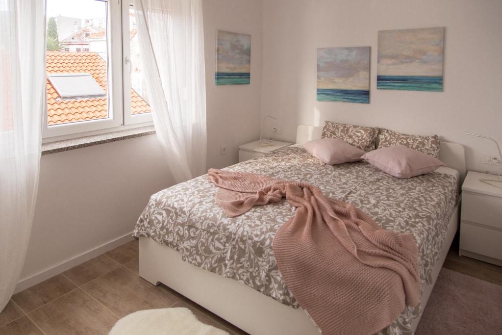 Posteľ alebo postele v izbe v ubytovaní Apartment Gordon